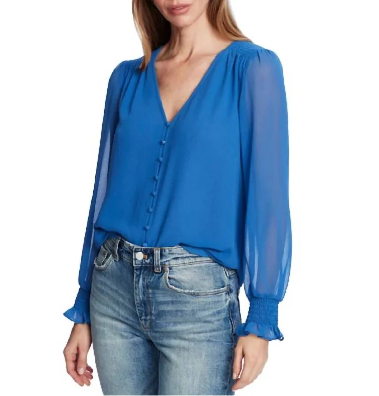 Long Sleeve Smocked Detail Button Front Harbor Waves Blouse In Blue Feminine Ruffle Blouse